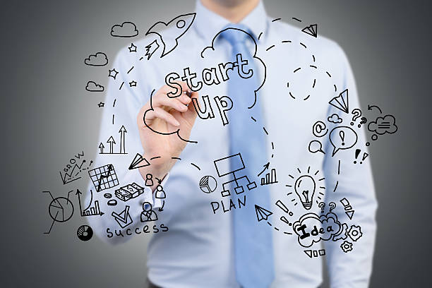 istock Businessman drawing project launching sketch on glassboard 638261292