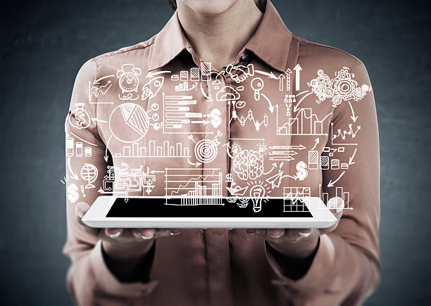 istock Woman with tablet and startup sketch 638264612