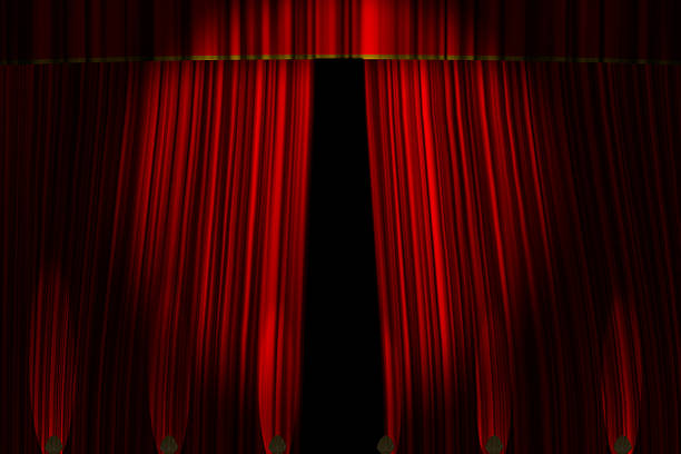 istock Stage or theatre curtains opening with footlights 638265140