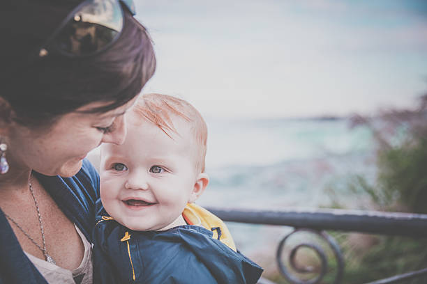 DSLR picture of a mother holding his baby boy at the famous Niagara Falls