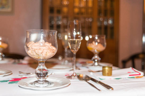 Festive decorated table with an appetizer and champagne