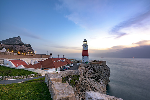 View of Europa point lighthouse and the rock of Gibraltar during sunrise