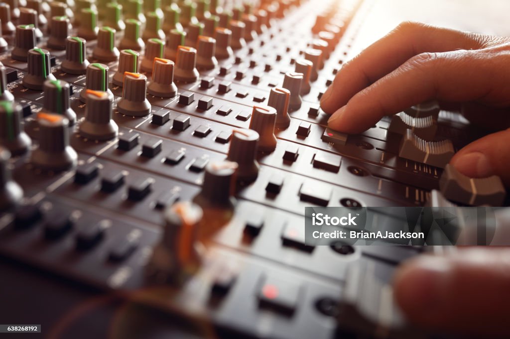 Sound recording studio mixer desk Sound recording studio mixing desk with engineer or music producer Music Stock Photo