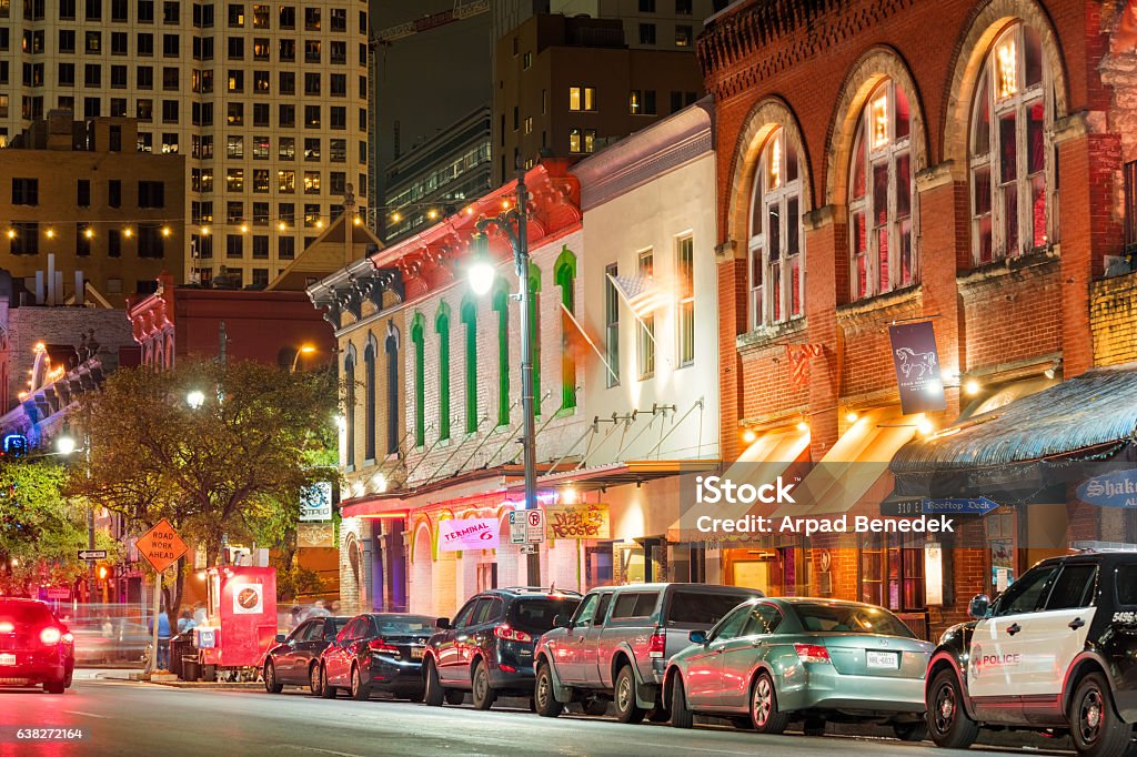 Sixth Street Entertainment District in Austin Texas USA Photo of colorful bars, clubs and businesses at the famous Sixth Street music and entertainment district of downtown Austin, Texas, USA, illuminated at night. Austin - Texas Stock Photo