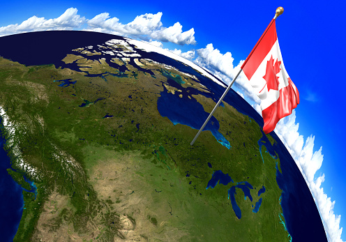 3D render of the national flag of Canada over the geographic location of the country on a world map. Parts of this image furnished by NASA.