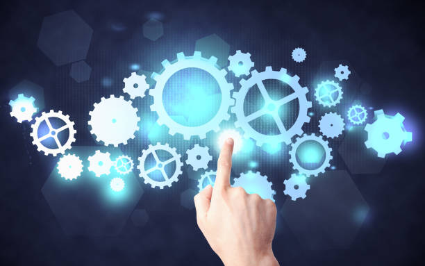 istock Hand pushing cogwheel mechanism 638276320
