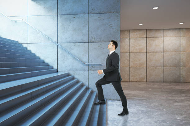 istock Businessman climbing success stairs side 638279840