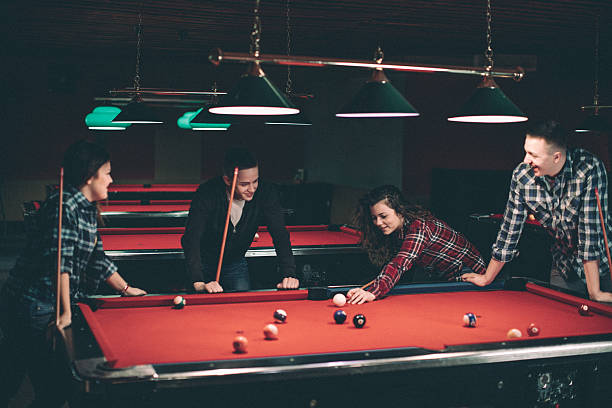 istock Young happy people communicating and playing billiard 638287762