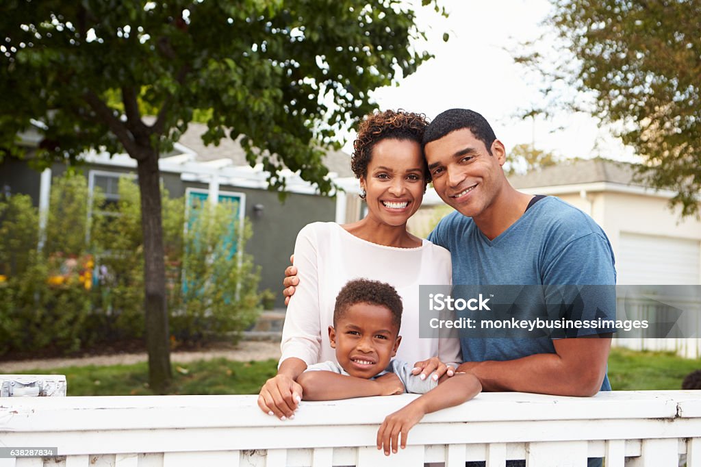 Young African American family outside their new house Family Stock Photo