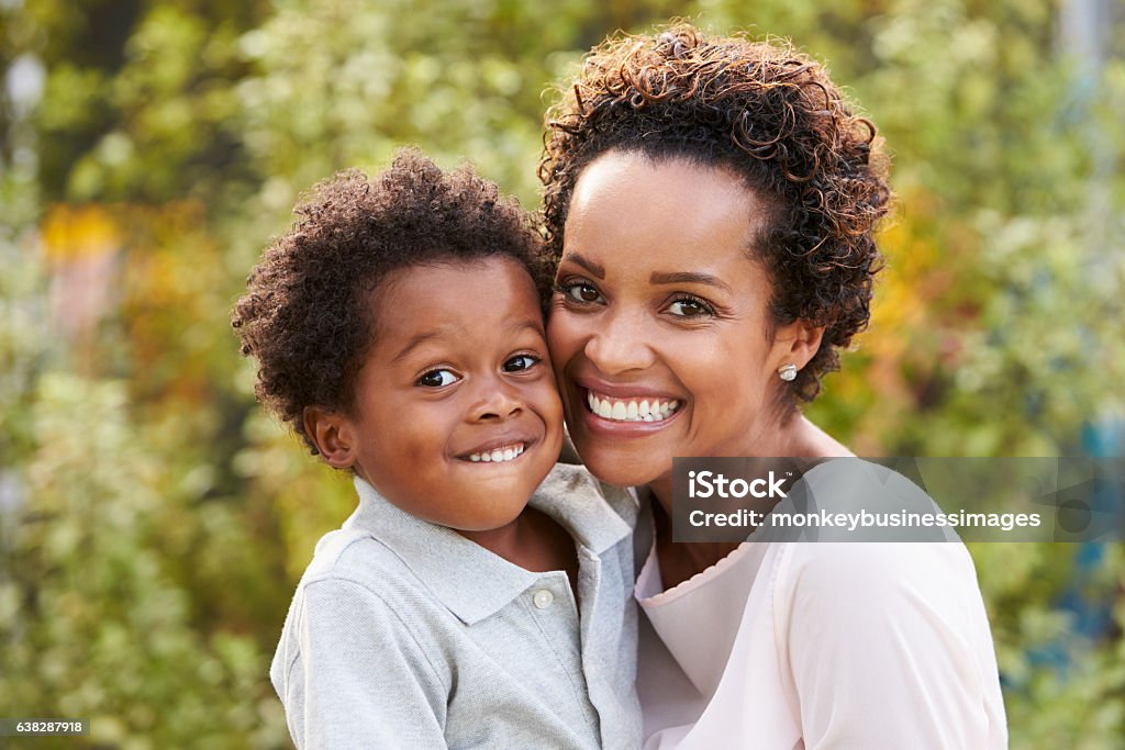 Portrait of young African American mother with toddler son Mother Stock Photo