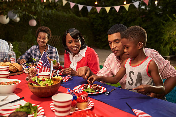istock Multi generation black family members at a 4th July barbecue 638288250