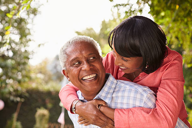 istock Senior black couple piggyback, looking at each other 638288322