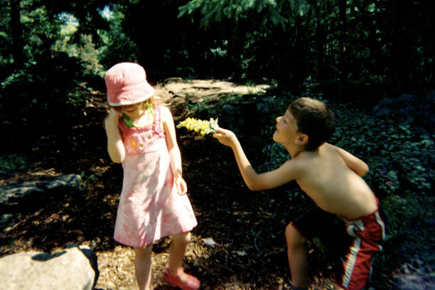 istock Boy offering flower to a girl 638288444