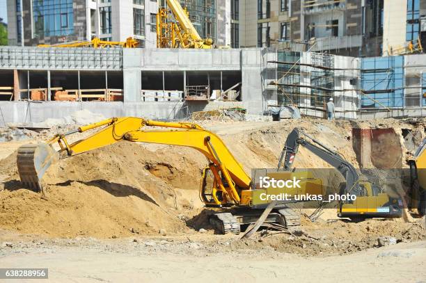 Excavating Machine On Construction Site Stock Photo - Download Image Now - Digging, Business, Construction Site