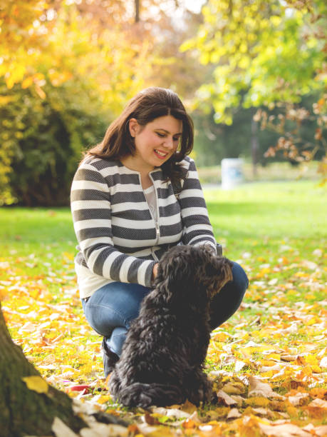 istock young woman walking with her Dog 638289120
