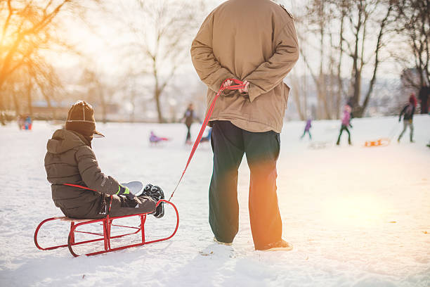 istock Father and son ready to slide down the hill 638291564