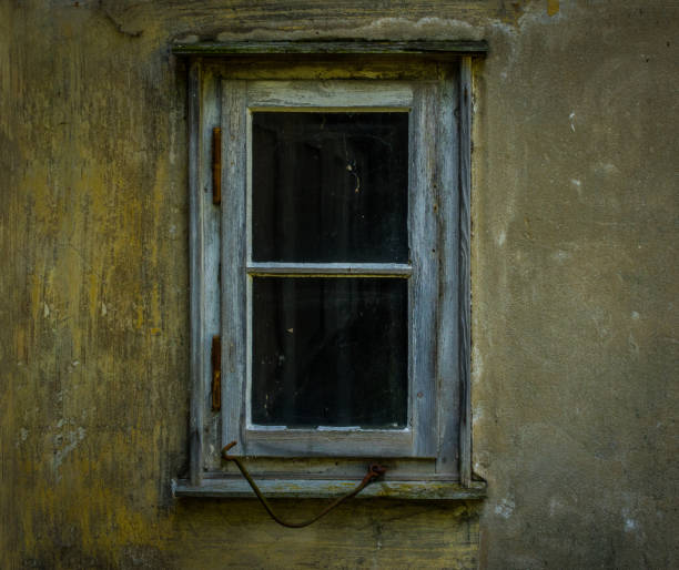 istock The old and dilapidated window of a  house 638293072