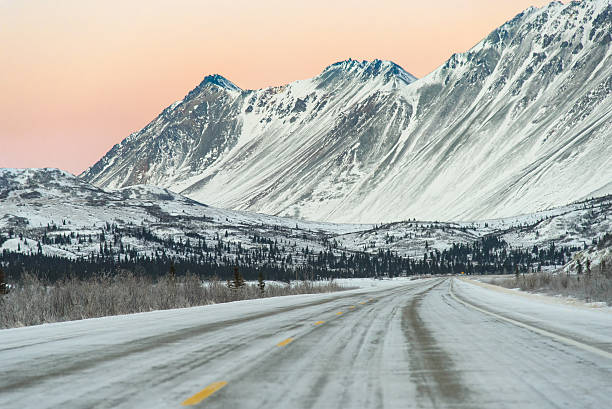 istock Sunset on Remote Alaska Highway With Snow Capped Mountains 638293732