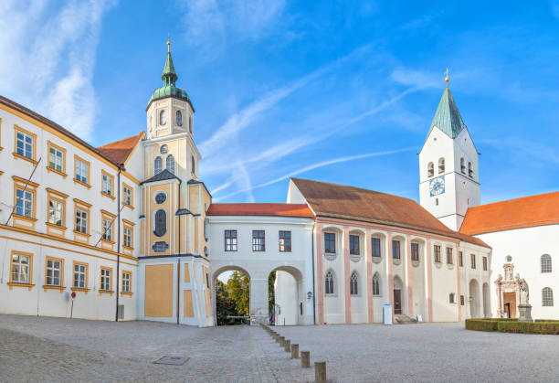Munich: City road with main clock tower on background in Erding City, Munich