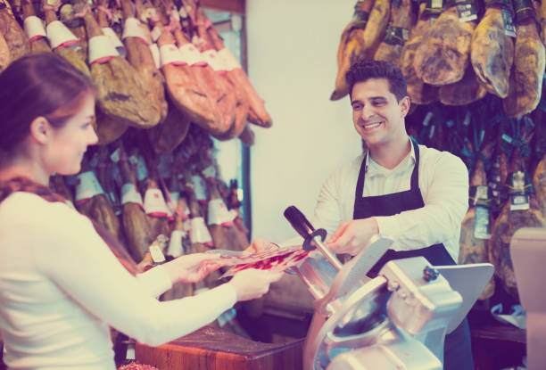 istock Female customer buying Spanish jamon 638302680