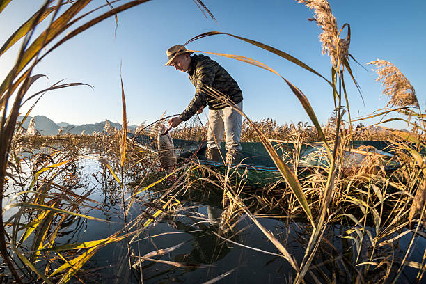 istock Fisherman in the boat 638303290
