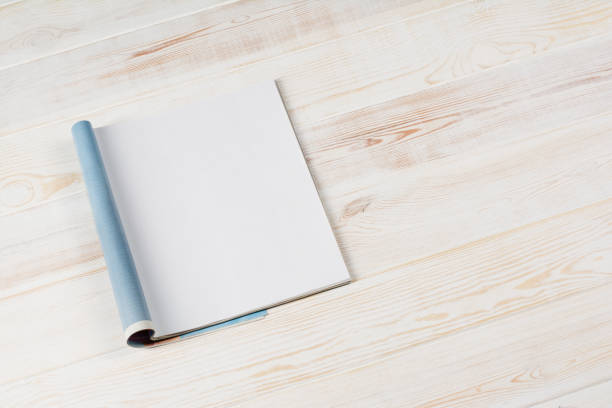 istock Mock-up magazines or catalog on wooden table background. 638303796