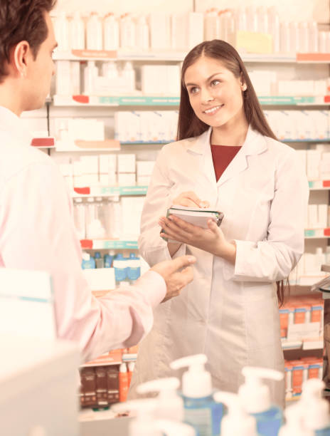 istock Pharmacist and consulting man in pharmacy 638303850