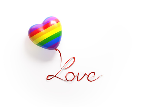 Rainbow colored heart shaped balloon on a white background. Balloon`s red satin string is forming love message on a white background. Isolated on white. Clipping path is included. Great use for gay love, gay romance, gay marriage and gay Valentine`s day related concepts.