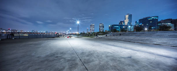 empty road near river in seoul at night