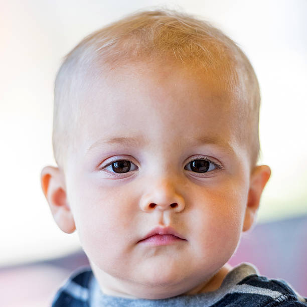 istock Baby boy looking at the camera 638312396