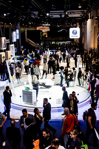Las Vegas, NV, USA.. Jan. 7, 2017: Visitors inspect displays of vehicle technology at the VW exhibit at CES 2017.