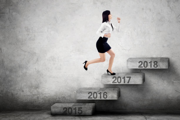 istock Businesswoman steps on stairs with 2017 638316244