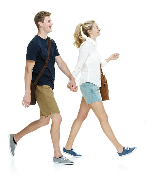 istock Smiling couple holding hands and walking 638317056