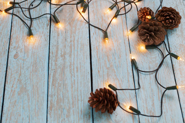 istock christmas lights on blue wooden background 638318206