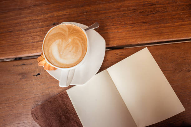 istock Cup of hot coffee latte on the wood table. 638321488