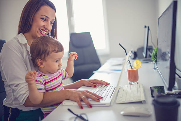 istock Mom and her child in office 638323446