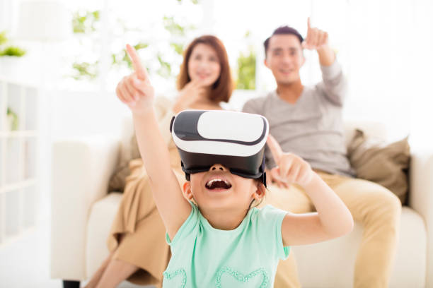 happy family with virtual reality headset in living room