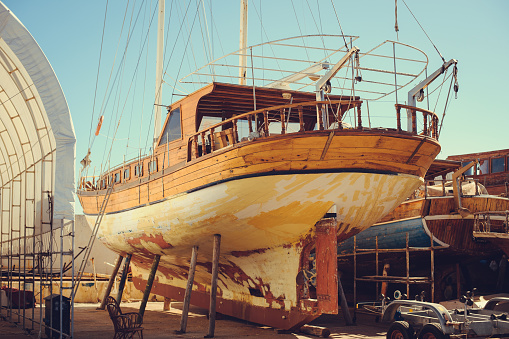 repair of wooden boats and yachts, dry-dock, boats are raised and waiting for repairs