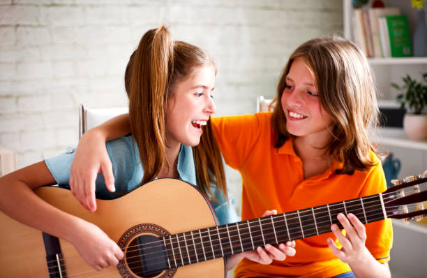 istock Teenagers playing guitar 638327676