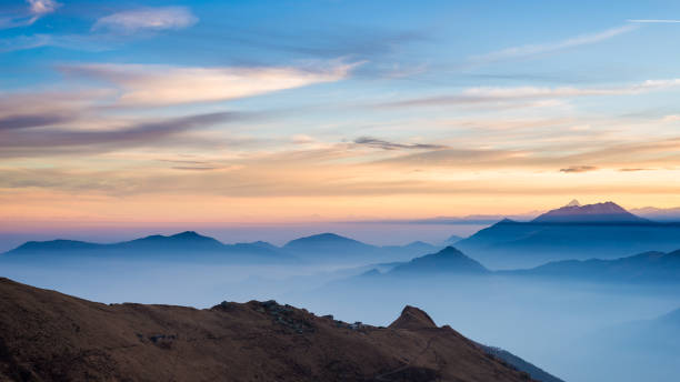 istock Mountain silhouette and stunning sky with moon at sunset 638327972