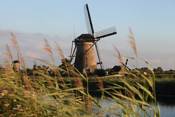Dutch Holland windmill field canal sunset Kinderdijk Netherlands