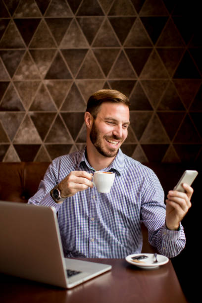 istock oung man sitting in cafes, drinking coffee and looking 638332434