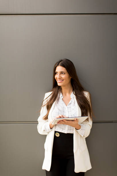 istock Young woman with tablet 638333116