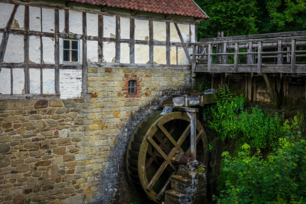 istock The old water mill on creek in village 638333204
