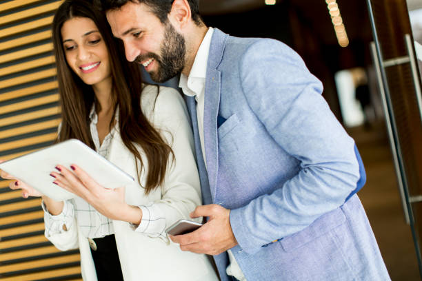 istock Business couple with tablet 638333216