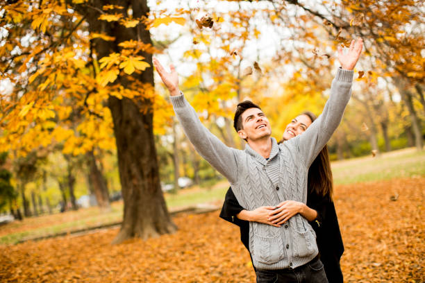 istock Young couple in the autumn park 638336346