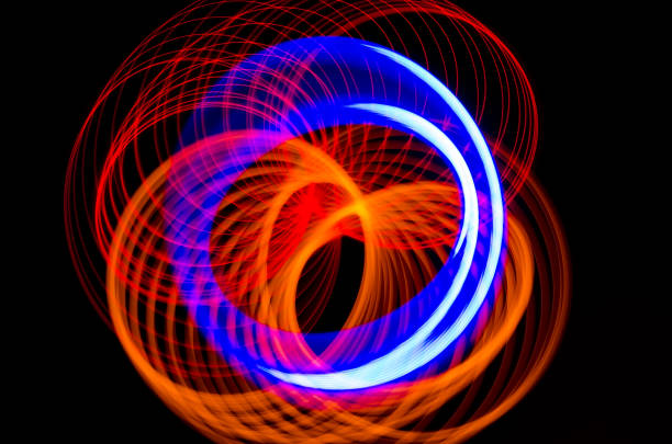 istock Light spiral, red and blue lines on a black background 638338944