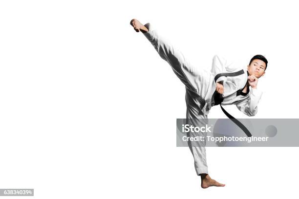 Portrait Of Asian Man Kick With Taekwondo Black Belt Stock Photo - Download Image Now