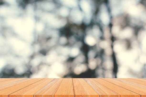 istock Wood plank and green forest 638340602
