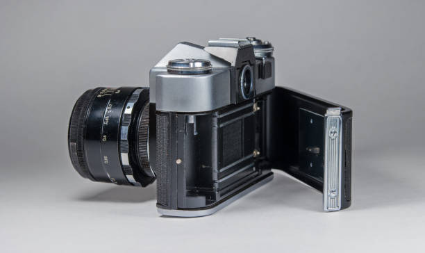 istock Old film camera photographed on a light background. 638343724